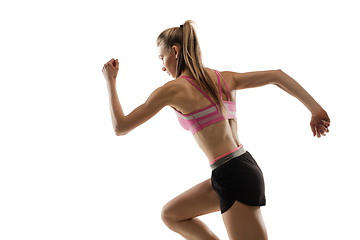 Image showing Caucasian professional female runner, athlete training isolated on white studio background. Copyspace for ad.