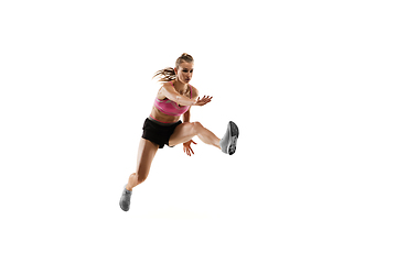 Image showing Caucasian professional female runner, athlete training isolated on white studio background. Copyspace for ad.