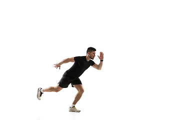 Image showing Caucasian professional sportsman training isolated on white studio background. Muscular, sportive man practicing.