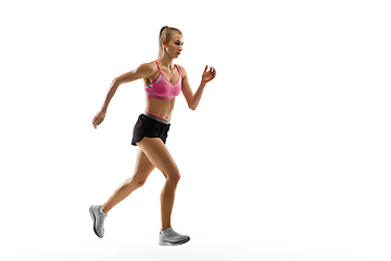 Image showing Caucasian professional female runner, athlete training isolated on white studio background. Copyspace for ad.