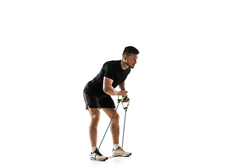 Image showing Caucasian professional sportsman training isolated on white studio background. Muscular, sportive man practicing.