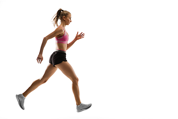 Image showing Caucasian professional female runner, athlete training isolated on white studio background. Copyspace for ad.