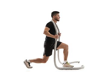 Image showing Caucasian professional sportsman training isolated on white studio background. Muscular, sportive man practicing.