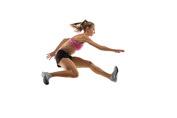 Image showing Caucasian professional female runner, athlete training isolated on white studio background. Copyspace for ad.