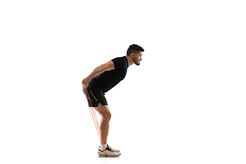 Image showing Caucasian professional sportsman training isolated on white studio background. Muscular, sportive man practicing.