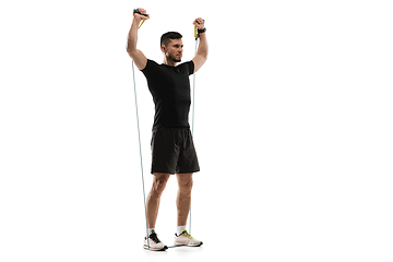 Image showing Caucasian professional sportsman training isolated on white studio background. Muscular, sportive man practicing.