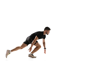 Image showing Caucasian professional sportsman training isolated on white studio background. Muscular, sportive man practicing.