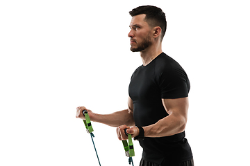 Image showing Caucasian professional sportsman training isolated on white studio background. Muscular, sportive man practicing.