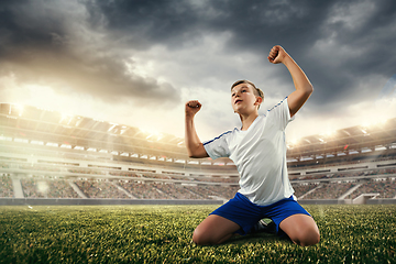 Image showing Junior football or soccer player at stadium - motion, action, activity concept