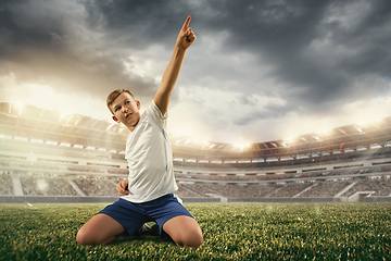 Image showing Junior football or soccer player at stadium - motion, action, activity concept