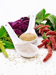 Image showing Flour and seeds amaranth in spoons on board