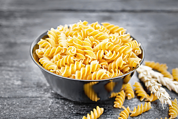 Image showing Fusilli whole grain in bowl on board