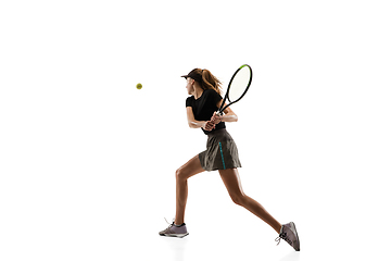 Image showing Young caucasian professional sportswoman playing tennis isolated on white background