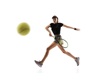 Image showing Young caucasian professional sportswoman playing tennis isolated on white background