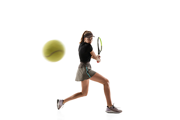 Image showing Young caucasian professional sportswoman playing tennis isolated on white background