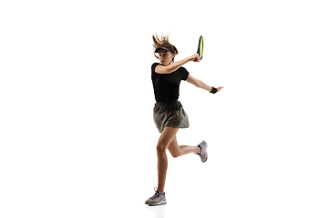 Image showing Young caucasian professional sportswoman playing tennis isolated on white background