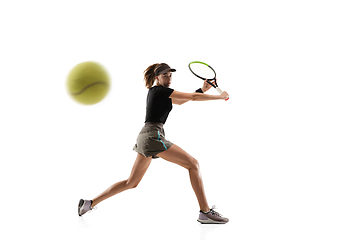 Image showing Young caucasian professional sportswoman playing tennis isolated on white background