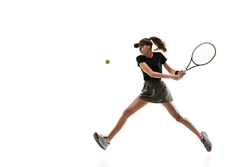 Image showing Young caucasian professional sportswoman playing tennis isolated on white background