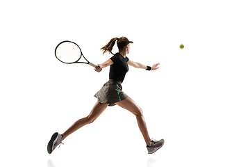 Image showing Young caucasian professional sportswoman playing tennis isolated on white background