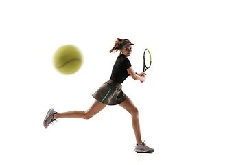 Image showing Young caucasian professional sportswoman playing tennis isolated on white background