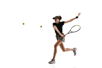 Image showing Young caucasian professional sportswoman playing tennis isolated on white background