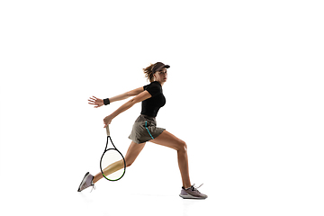 Image showing Young caucasian professional sportswoman playing tennis isolated on white background