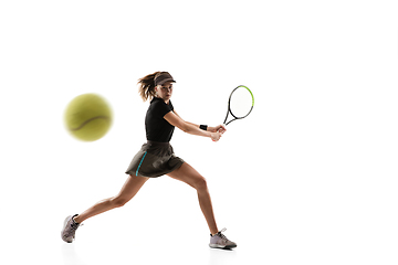 Image showing Young caucasian professional sportswoman playing tennis isolated on white background