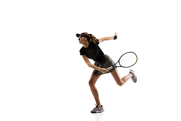 Image showing Young caucasian professional sportswoman playing tennis isolated on white background