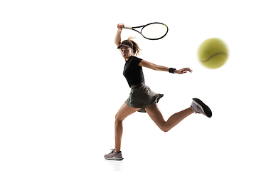 Image showing Young caucasian professional sportswoman playing tennis isolated on white background