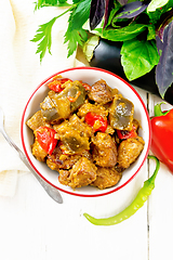 Image showing Meat with eggplant and pepper in bowl on board top