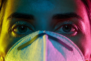 Image showing young woman wearing protective mask or respirator