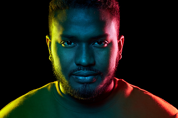 Image showing young african american man over black background