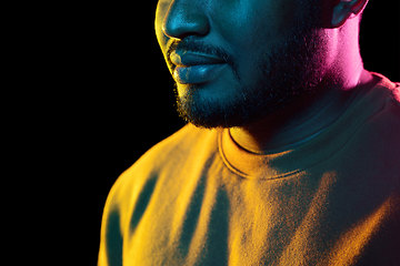 Image showing young african american man over black background