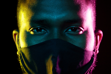 Image showing african american man wearing black reusable mask