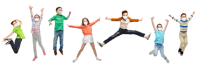 Image showing children in face protective masks jumping in air
