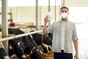 Image showing man or farmer in mask with milk on dairy farm