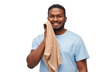 Image showing african american man wiping face with bath towel