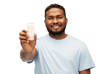 Image showing happy african american man showing moisturizer