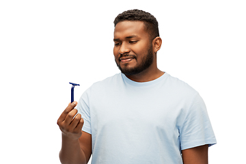 Image showing african american man holding razor blade