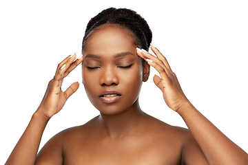 Image showing portrait of african woman doing face massage