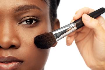 Image showing face of african woman and hand with make up brush