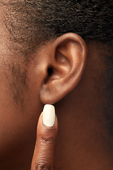 Image showing close up of african american woman's ear