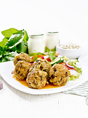 Image showing Meatballs with spinach and oatmeal on white board