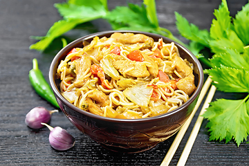 Image showing Noodles with cabbage and chicken in bowl on dark board