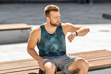 Image showing man with fitness tracker in city