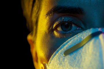 Image showing young woman wearing protective mask or respirator