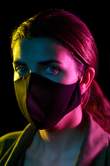 Image showing young woman wearing reusable protective mask