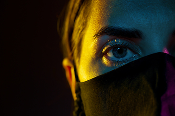 Image showing young woman wearing reusable protective mask