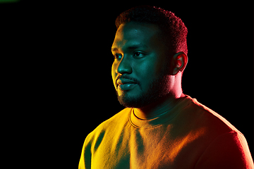 Image showing young african american man over black background