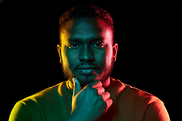 Image showing young african american man over black background